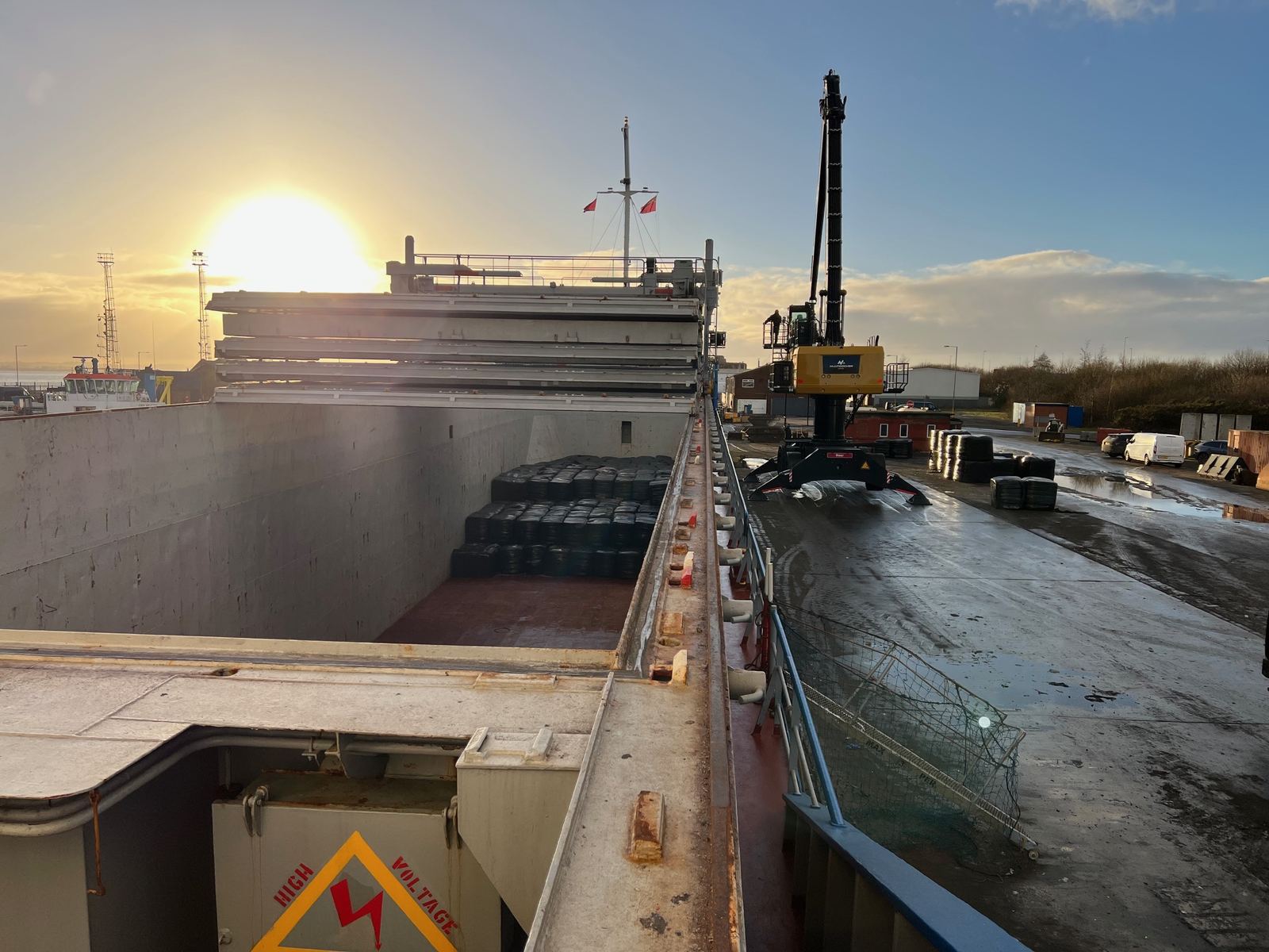 Loading fuel bales at sunrise